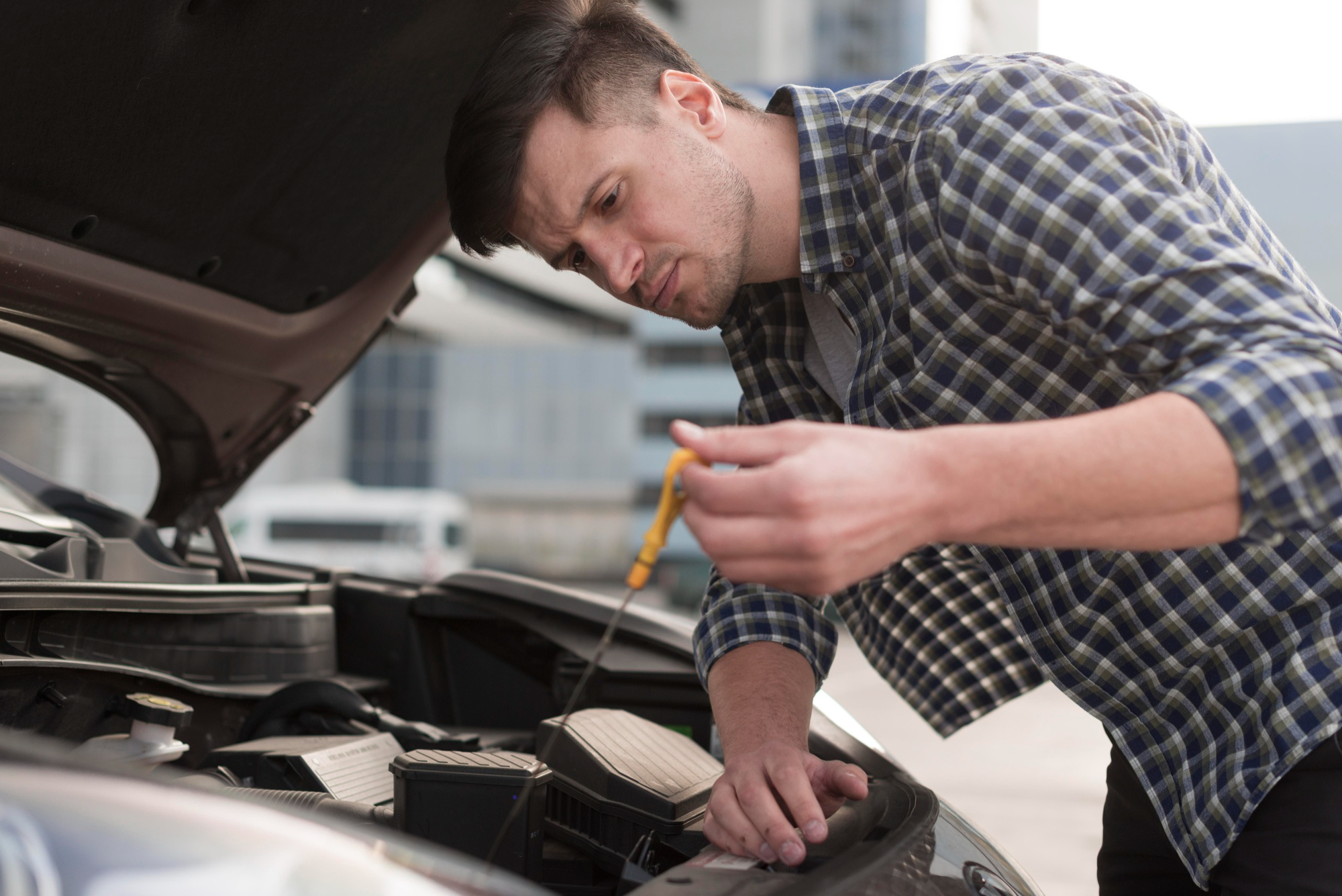 Mechanic checking fuel injector efficiency